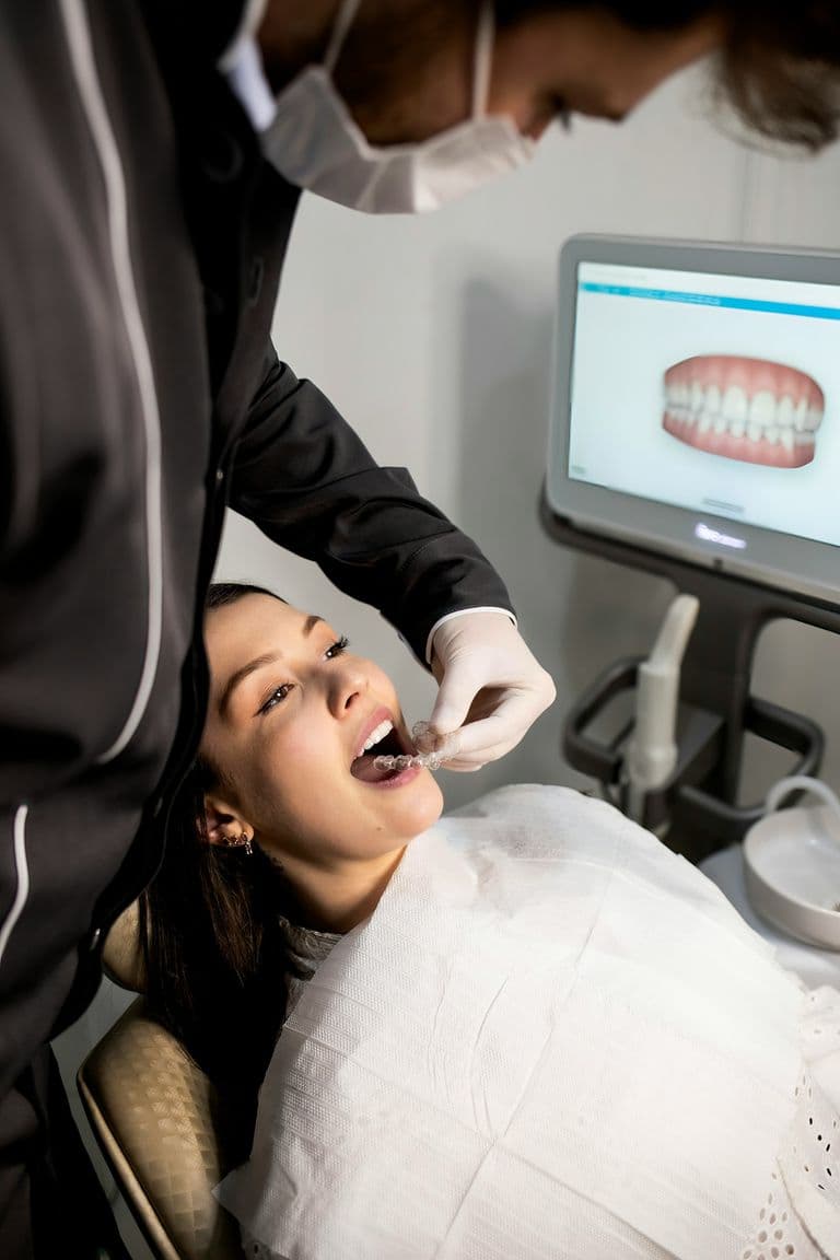 A denturist talking with a patient